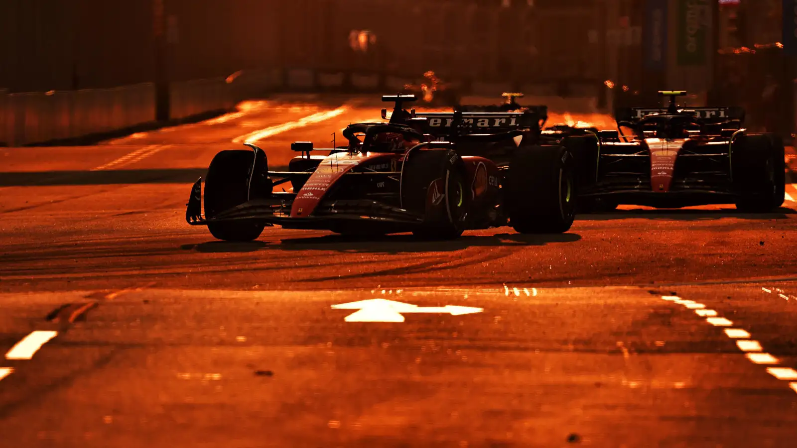 Ferrari teammates under lights at the Marina Bay circuit in Singapore.