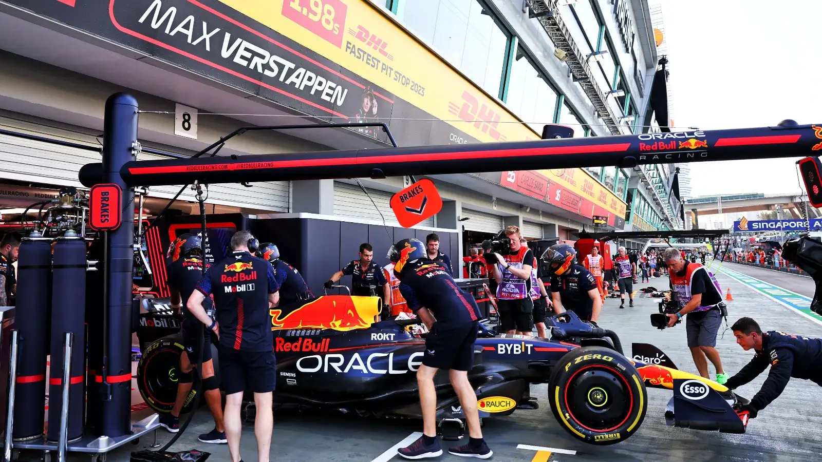 Max Verstappen's car is wheeled into the Red Bull garage.