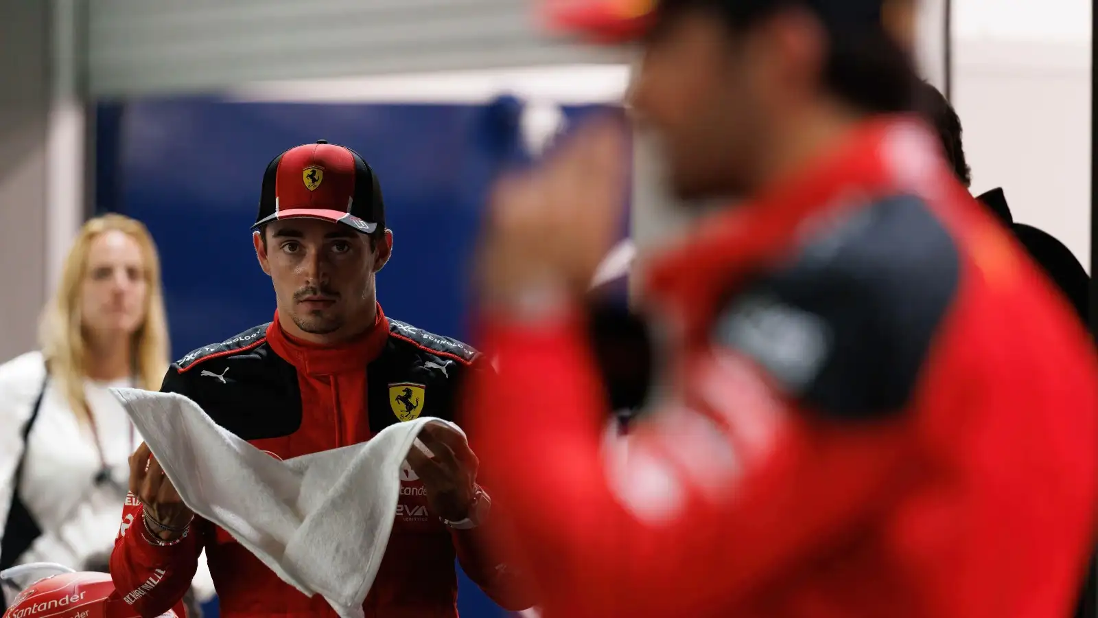 Charles Leclerc looking at Carlos Sainz