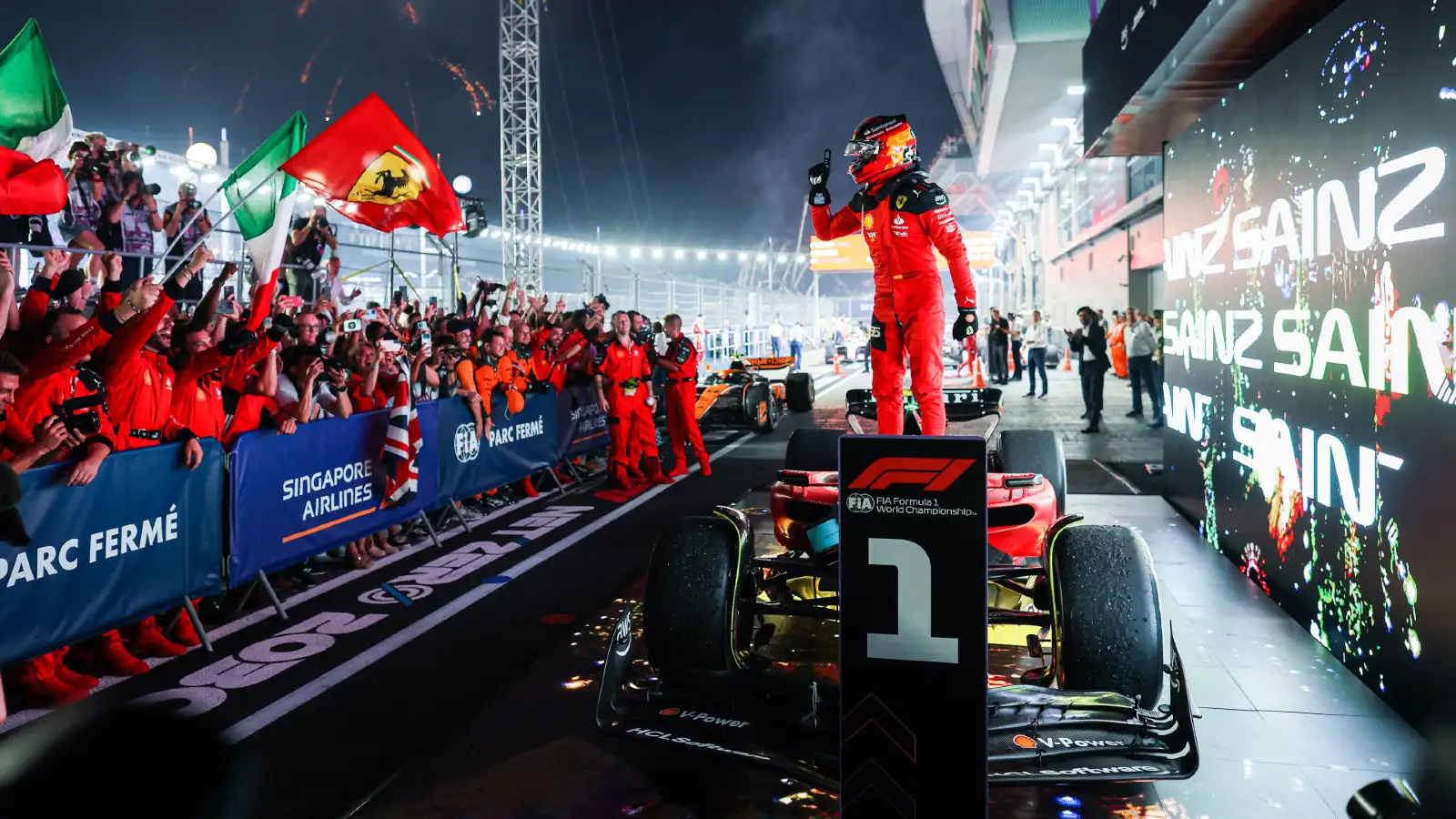 Ferrari driver Carlos Sainz celebrates victory at the Singapore Grand Prix.