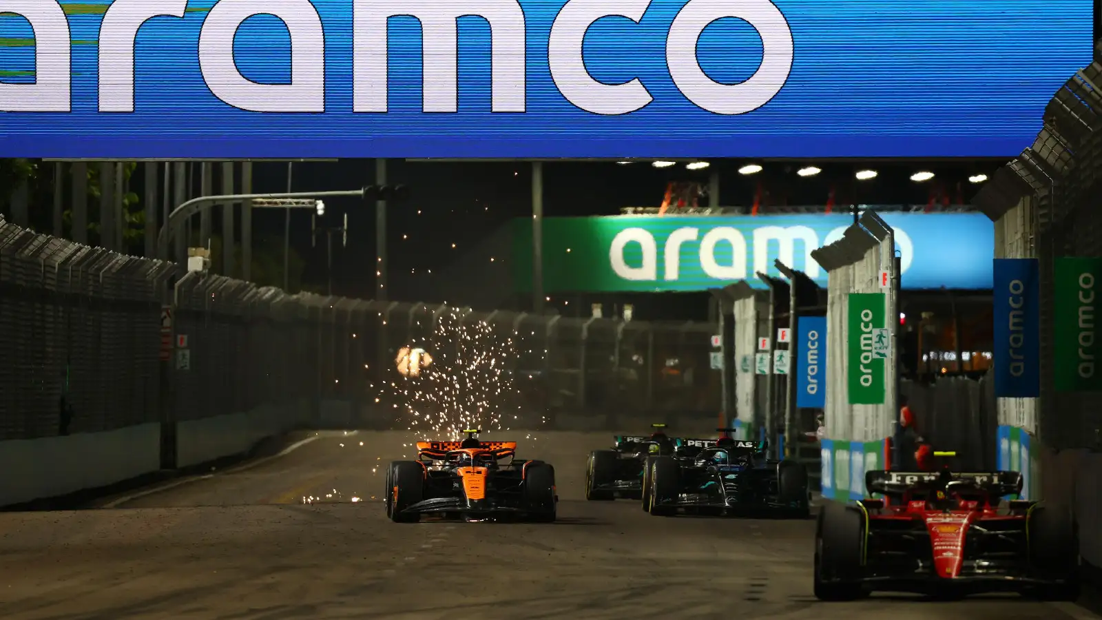 Ferrari's Carlos Sainz leads McLaren's Lando Norris and the two Mercedes at the Singapore Grand Prix.
