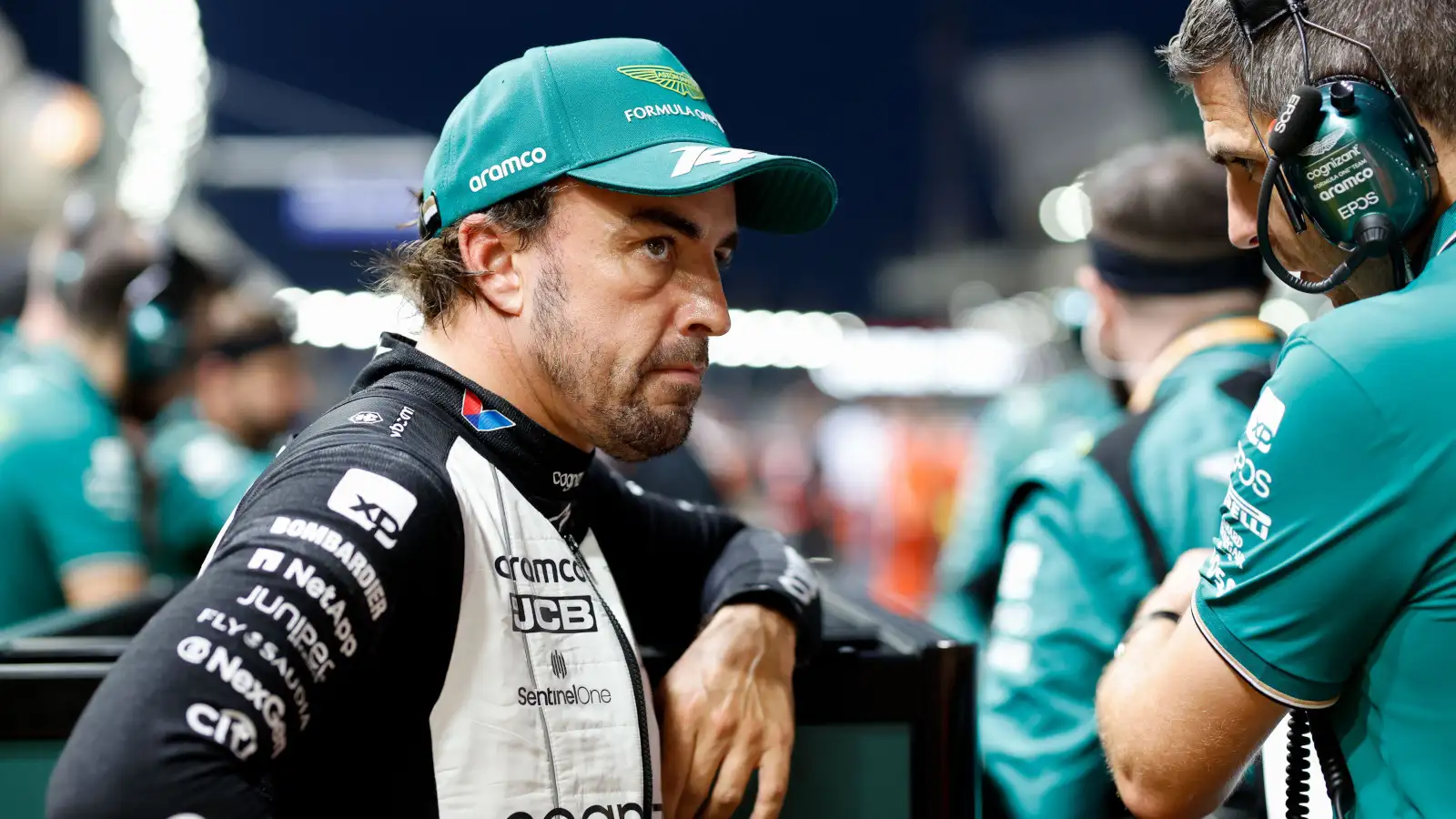 Spanish driver Fernando Alonso looking serious as he leans on the Aston Martin equipment ahead of the Singapore Grand Prix.