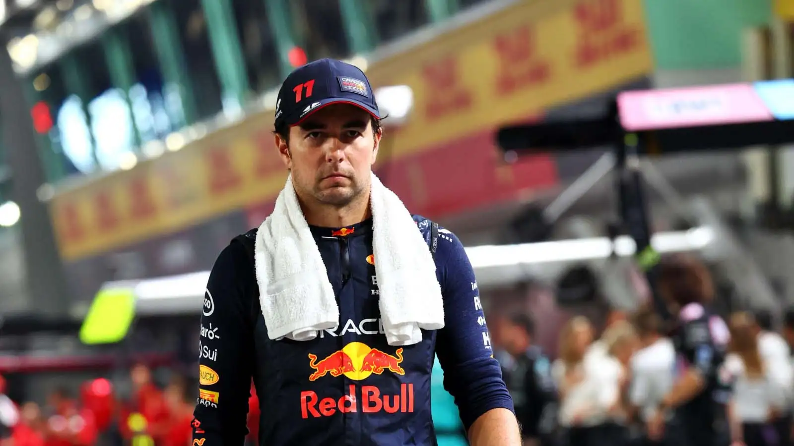 Sergio Perez walks through the pit lane in Singapore.