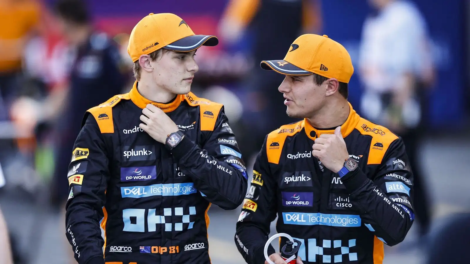 McLaren drivers Oscar Piastri and Lando Norris in conversation after 2023 Japanese Grand Prix qualifying.