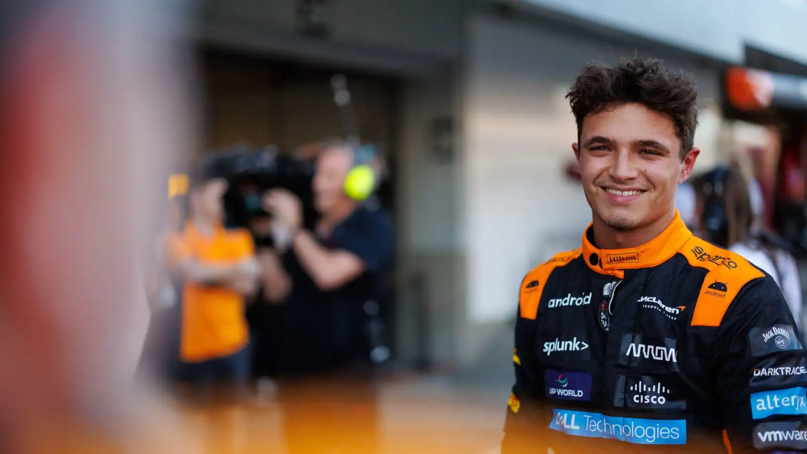 McLaren driver Lando Norris smiling after a great result in Japan.