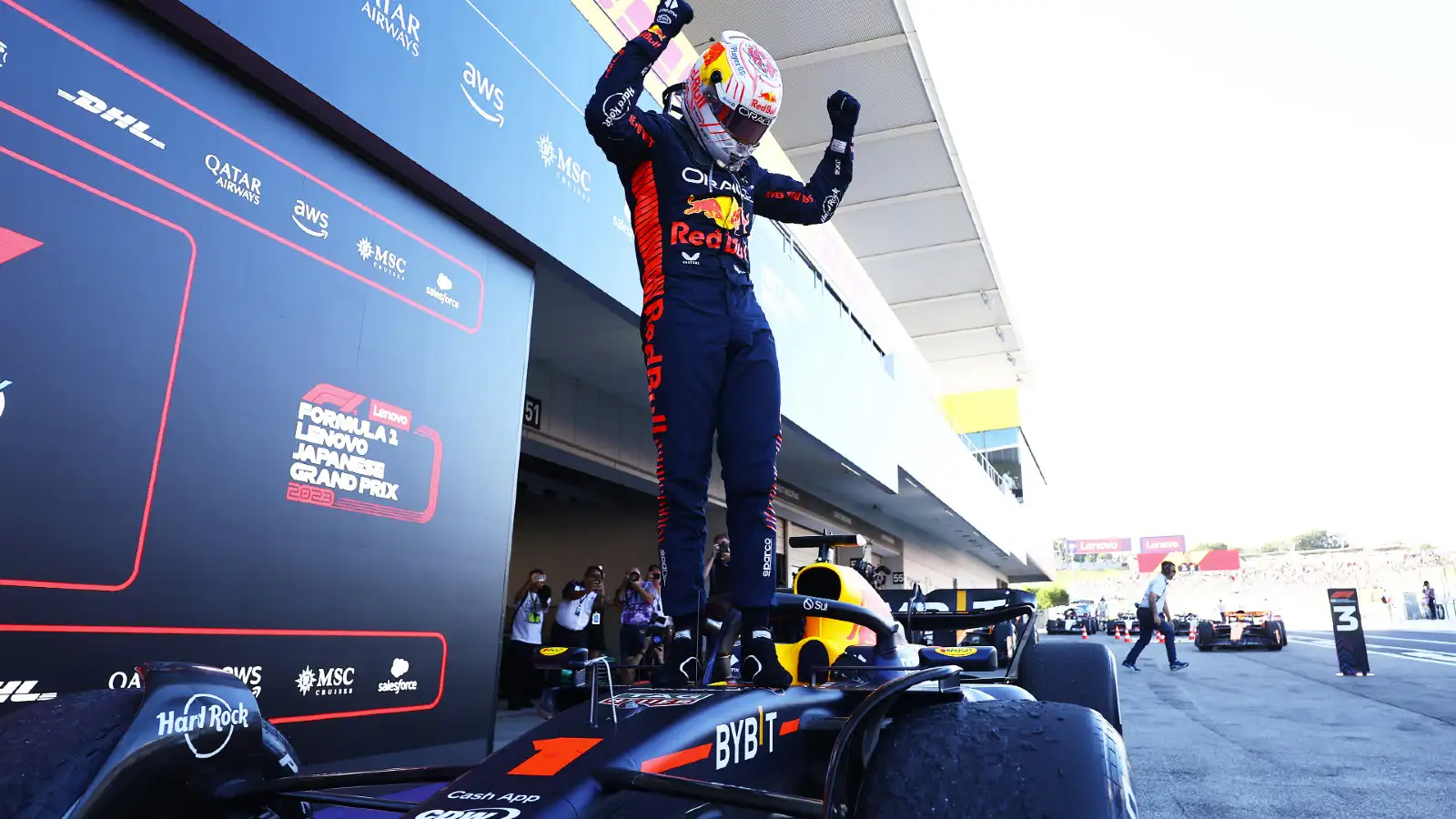 Red Bull's Max Verstappen celebrates victory in the pitlane at Suzuka at the Japanese Grand Prix.