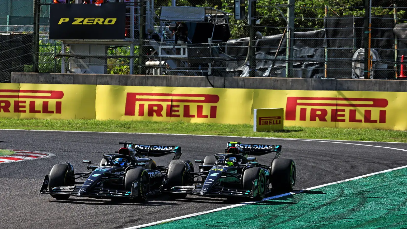 Mercedes drivers George Russell and Lewis Hamilton battle during the Japanese Grand Prix.