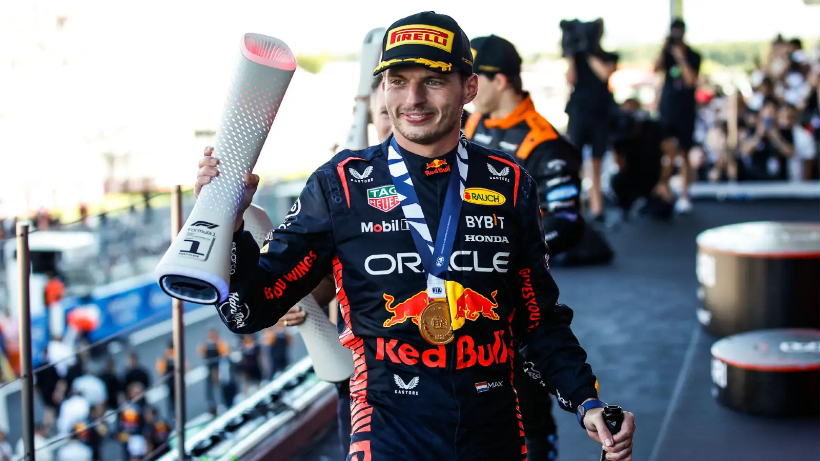 Red Bull's Max Verstappen celebrates on the podium after winning the Japanese Grand Prix.