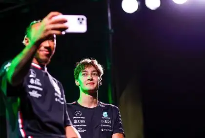 Mercedes drivers Lewis Hamilton and George Russell pose for a selfie at the 2023 Japanese Grand Prix.
