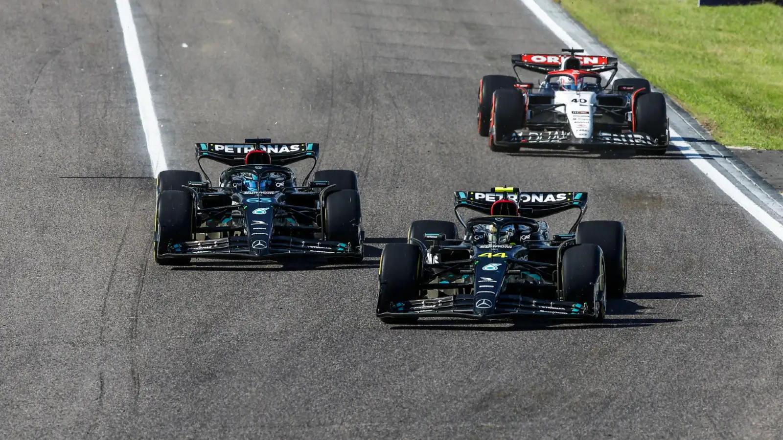 Mercedes' Lewis Hamilton and George Russell battle during the Japanese Grand Prix.