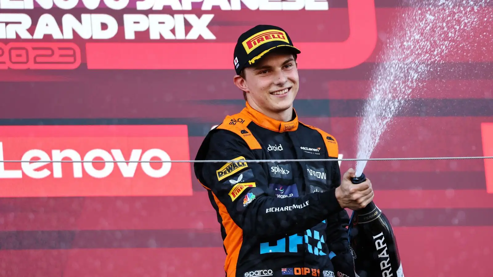 McLaren driver Oscar Piastri sprays the champagne after claiming his maiden F1 podium at Suzuka.