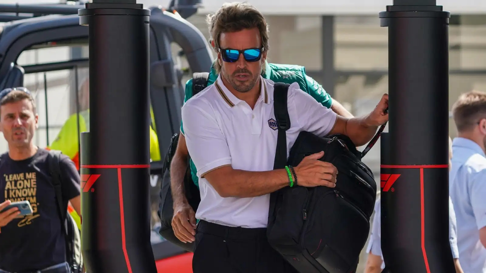 Aston Martin's Fernando Alonso entering the paddock at the Italian Grand Prix.