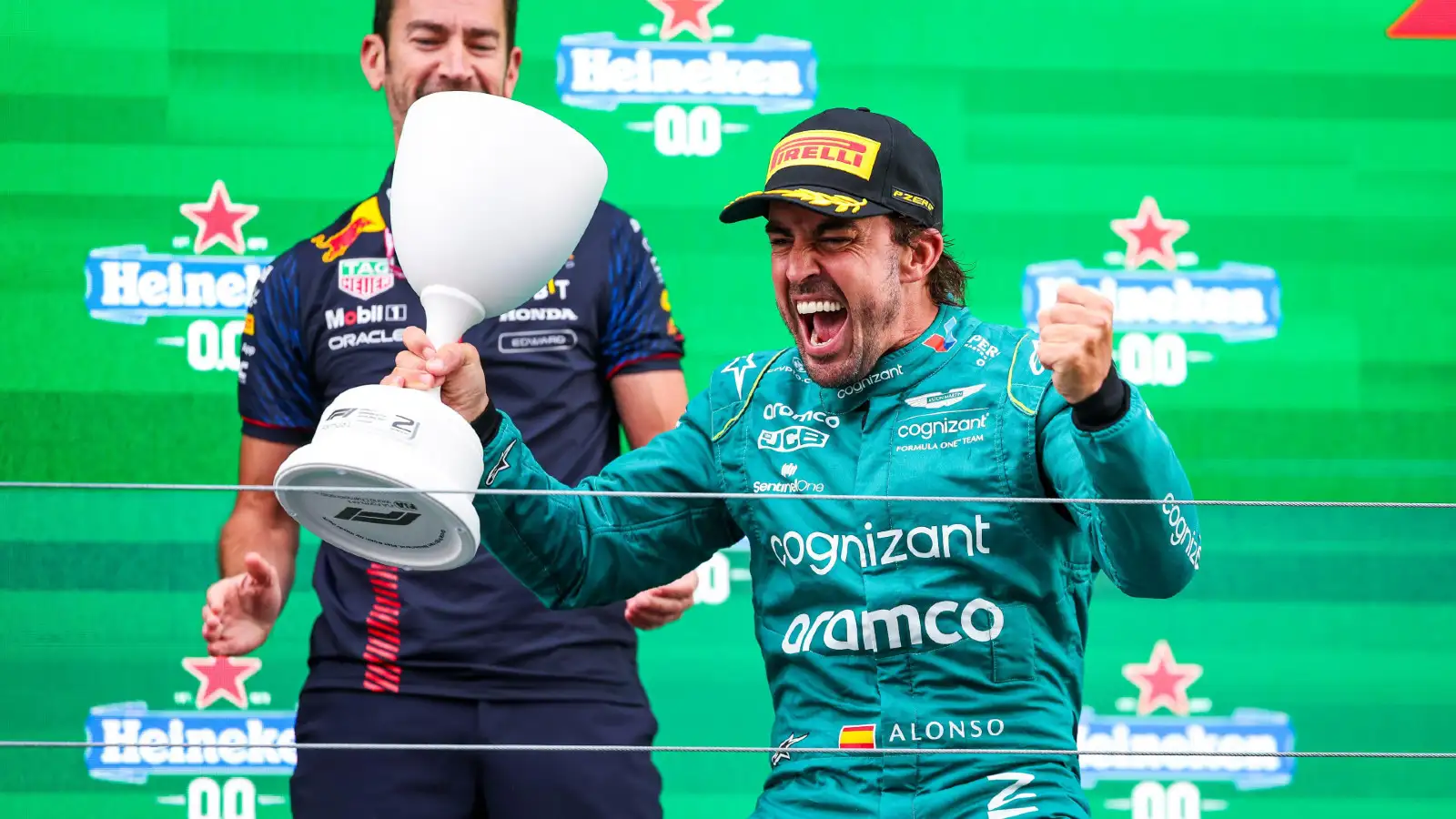 Aston Martin's Fernando Alonso celebrates on the podium at the Dutch Grand Prix.