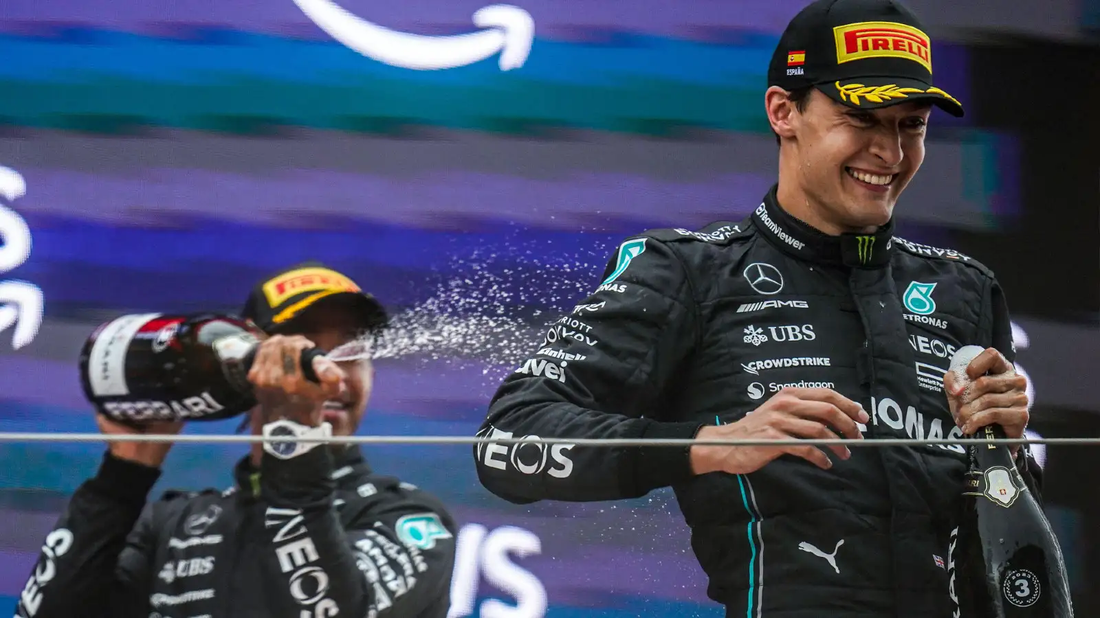 Mercedes' Lewis Hamilton and George Russell on the podium at the Spanish Grand Prix.