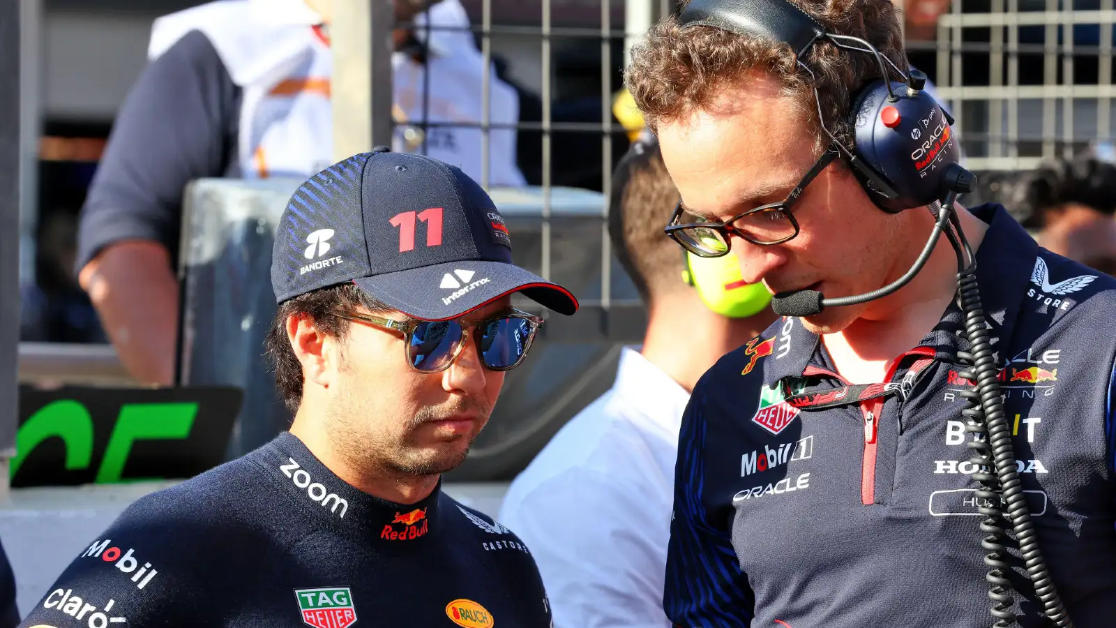 Red Bull's Sergio Perez speaks with his engineer Hugh Bird at the Azerbaijan Grand Prix.
