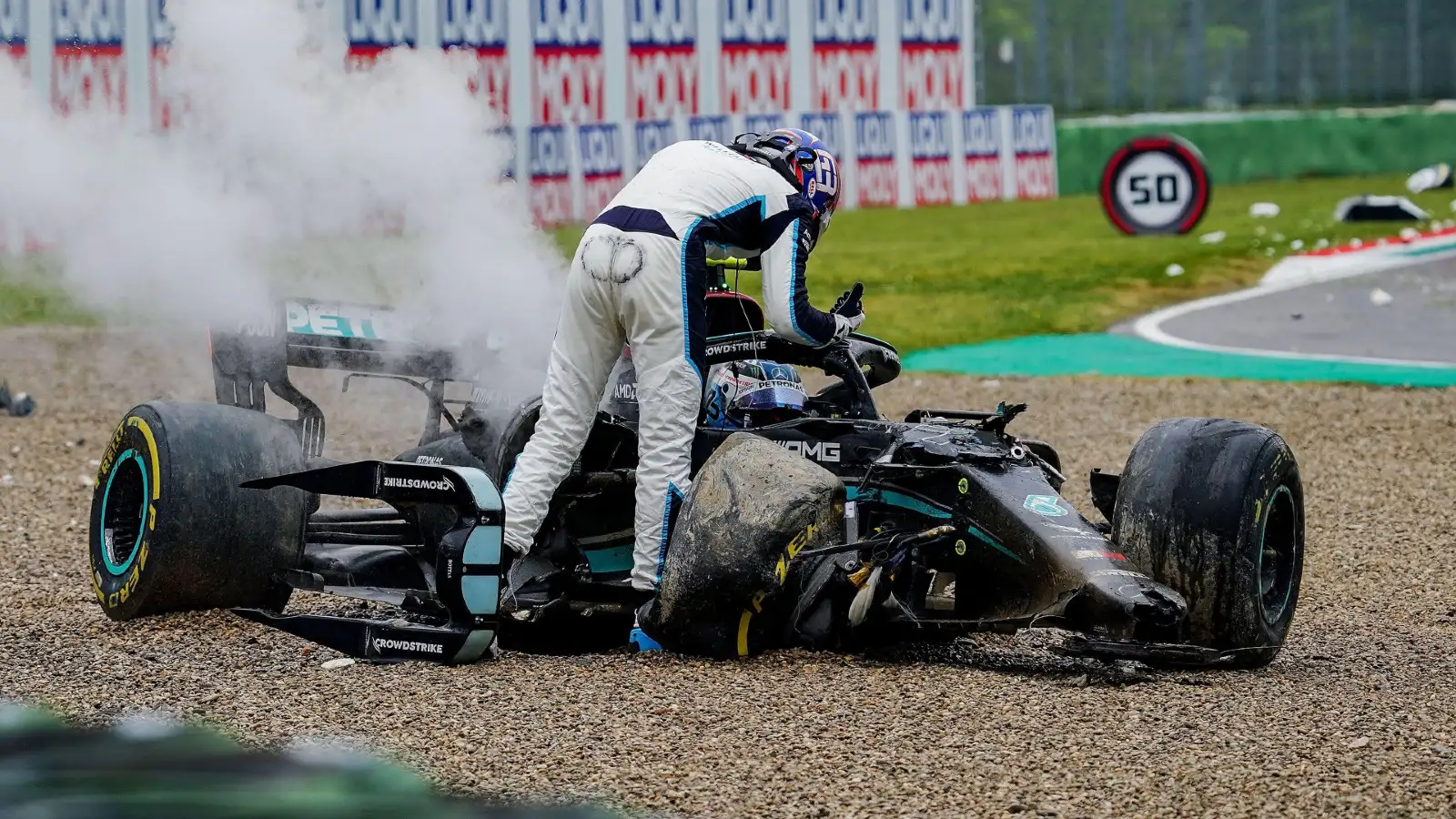 Williams' George Russell confronts Mercedes' Lewis Hamilton following their collision at the 2021 Emilia Romagna Grand Prix.