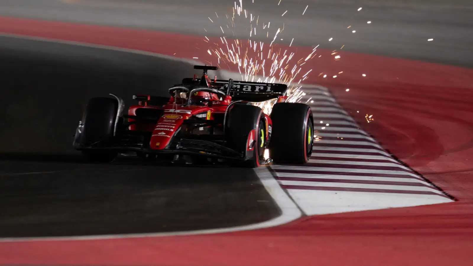Ferrari driver Charles Leclerc kicks up sparks at the 2023 Qatar Grand Prix.