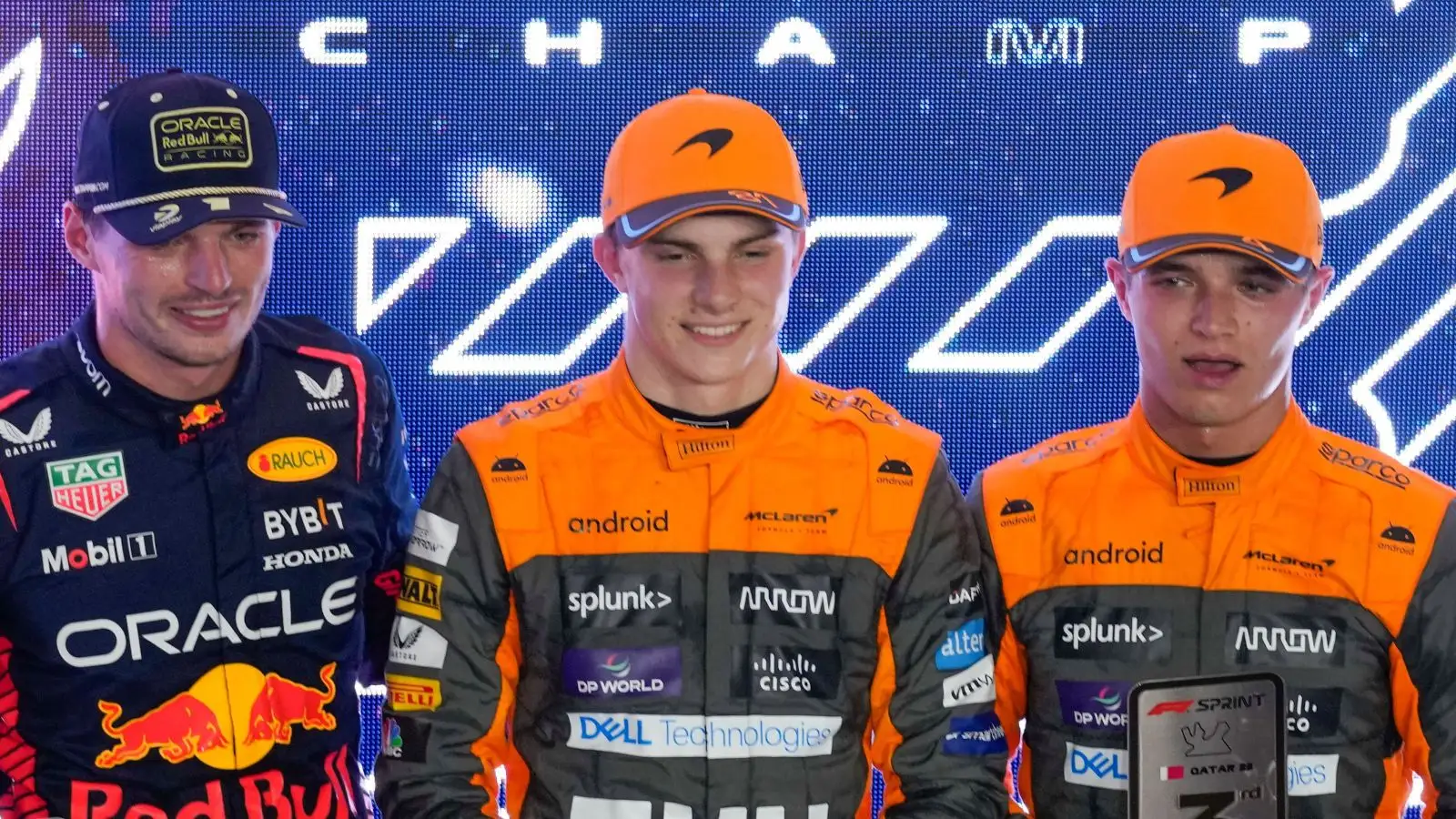 Max Verstappen, Oscar Piastri and Lando Norris pose for the cameras after the Qatar Grand Prix sprint race.