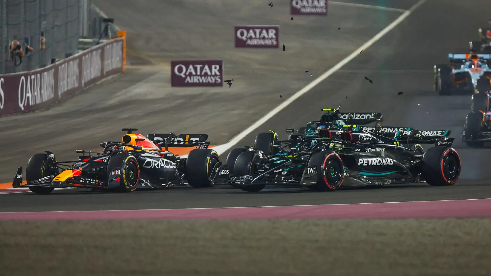 Mercedes' Lewis Hamilton and George Russell collide on the opening lap of the Qatar Grand Prix.