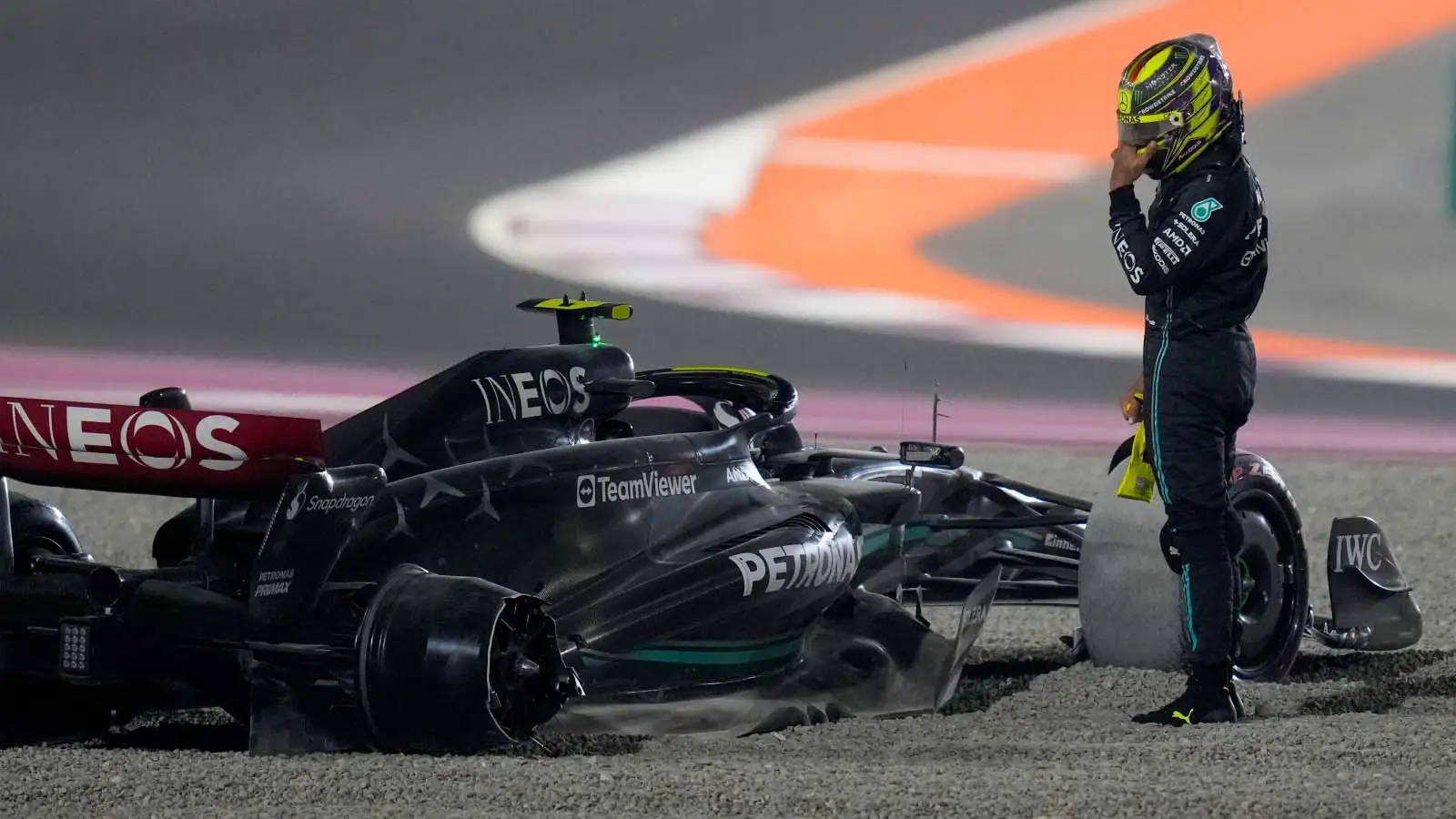 Lewis Hamilton stands by his stricken Mercedes