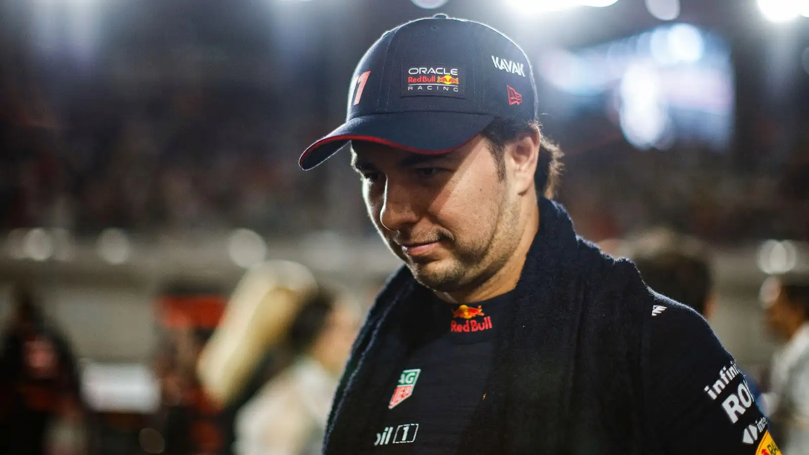 Sergio Perez walks through the Qatar GP paddock