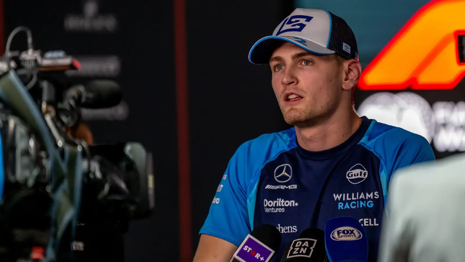 Williams' Logan Sargeant speaks to the media during the Qatar Grand Prix.