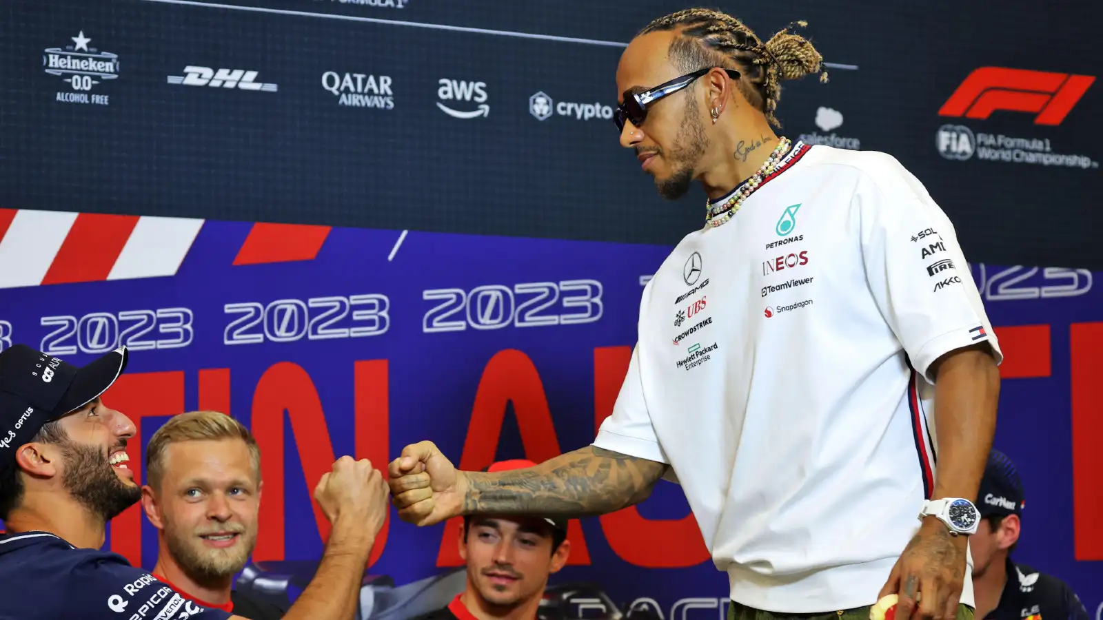 Daniel Ricciardo and Lewis Hamilton bump fists in the FIA Press Conference at the United States Grand Prix.