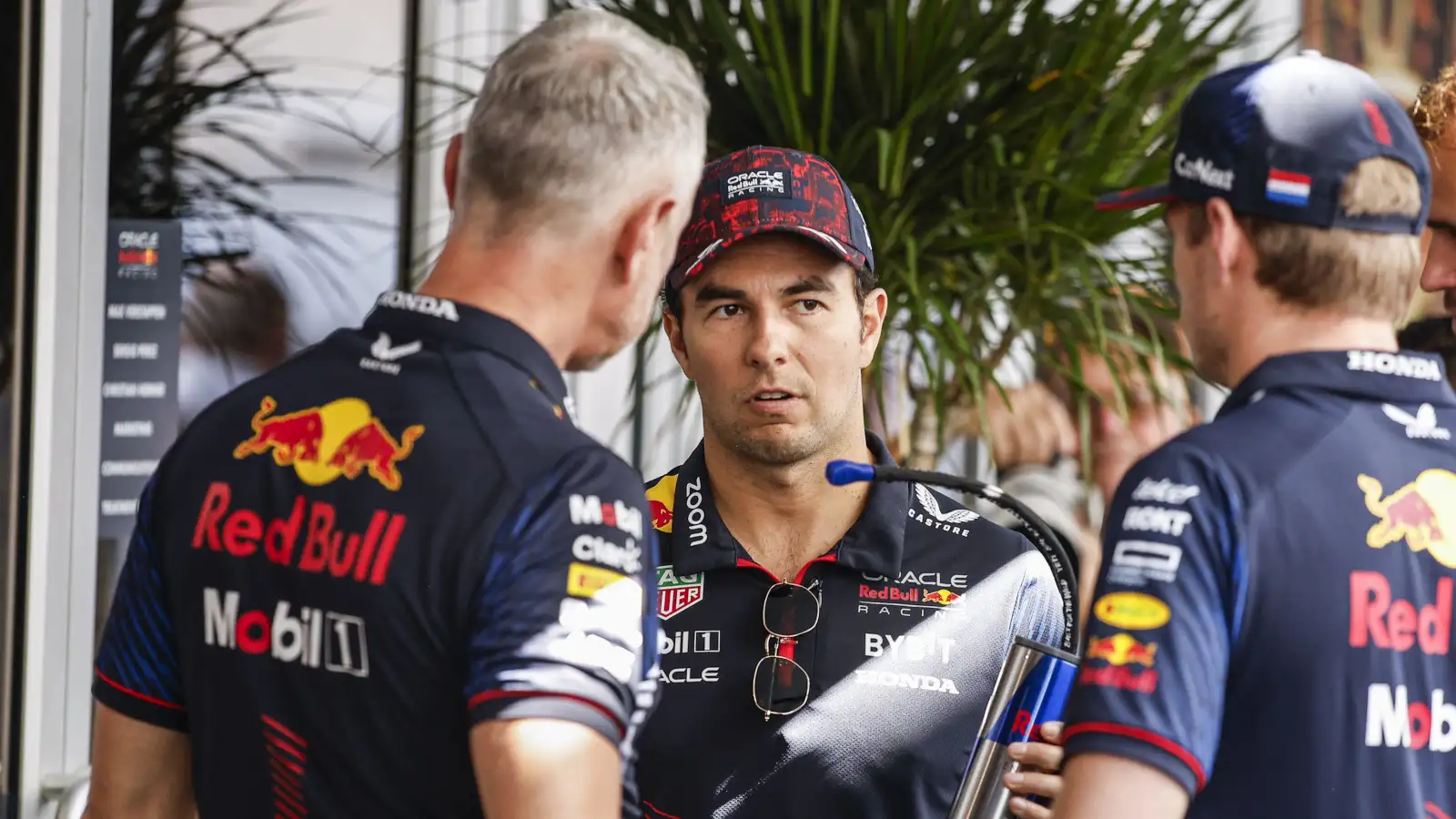 Sergio Perez speaking with Max Verstappen and Red Bull team manager Jonathan Wheatley.