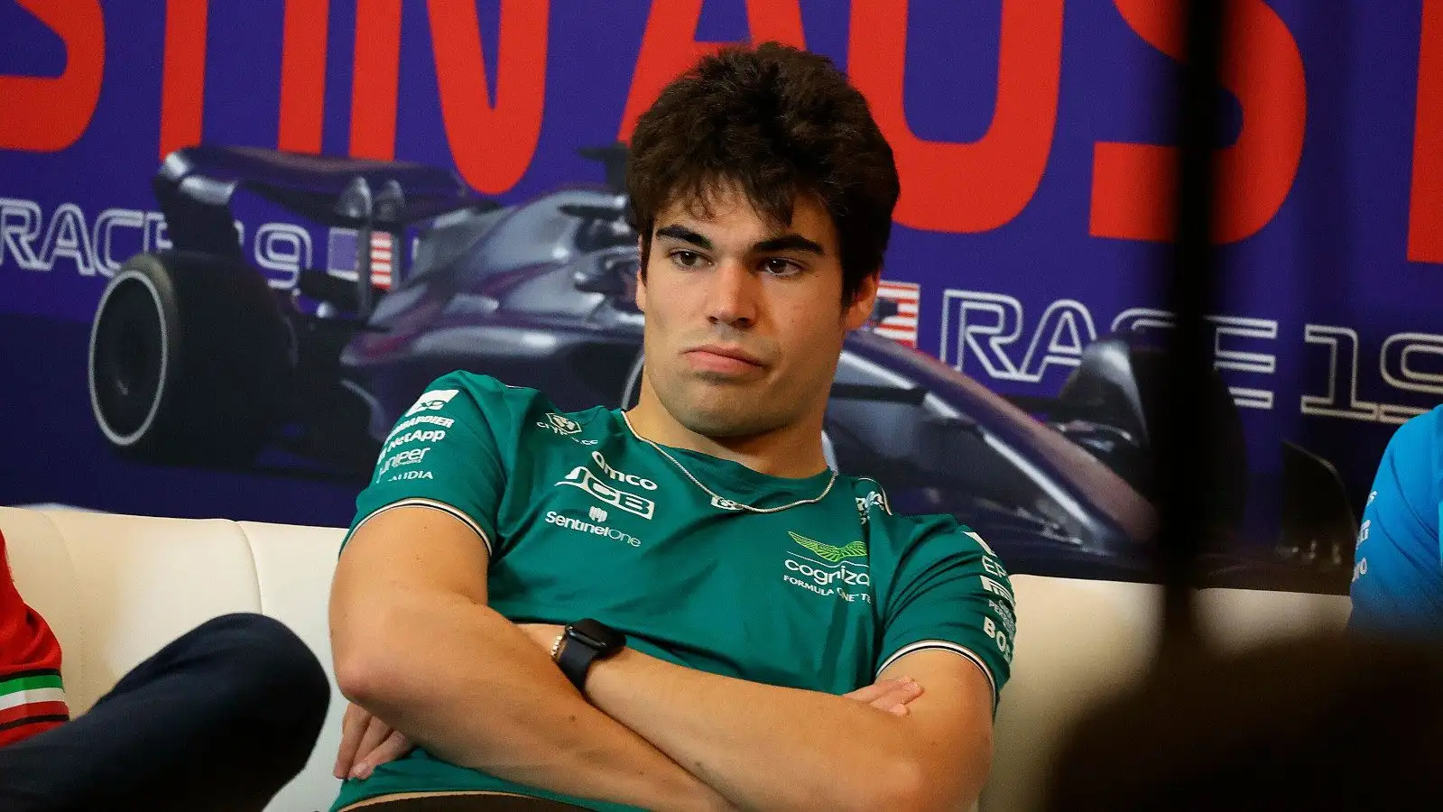 Aston Martin driver Lance Stroll arms crossed in a press conference