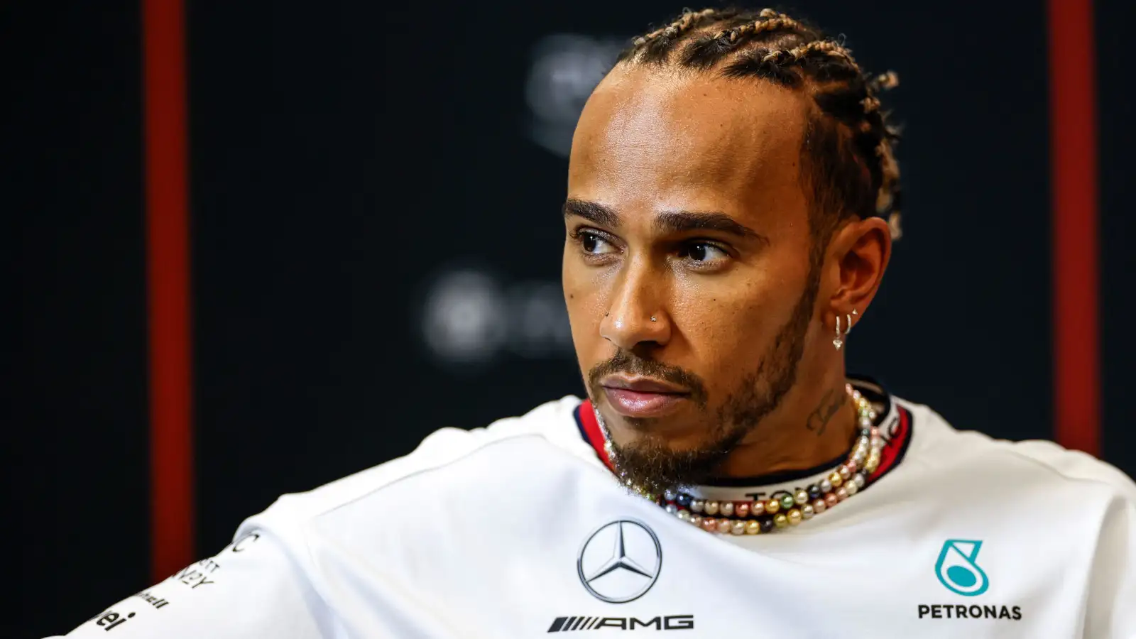 Mercedes driver Lewis Hamilton looking serious in a press conference.