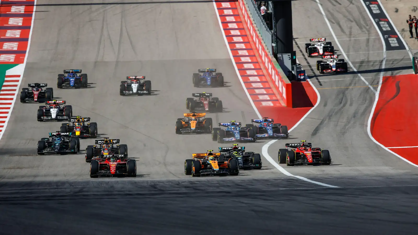 McLaren's Lando Norris takes the lead at the start of the US Grand Prix at COTA.