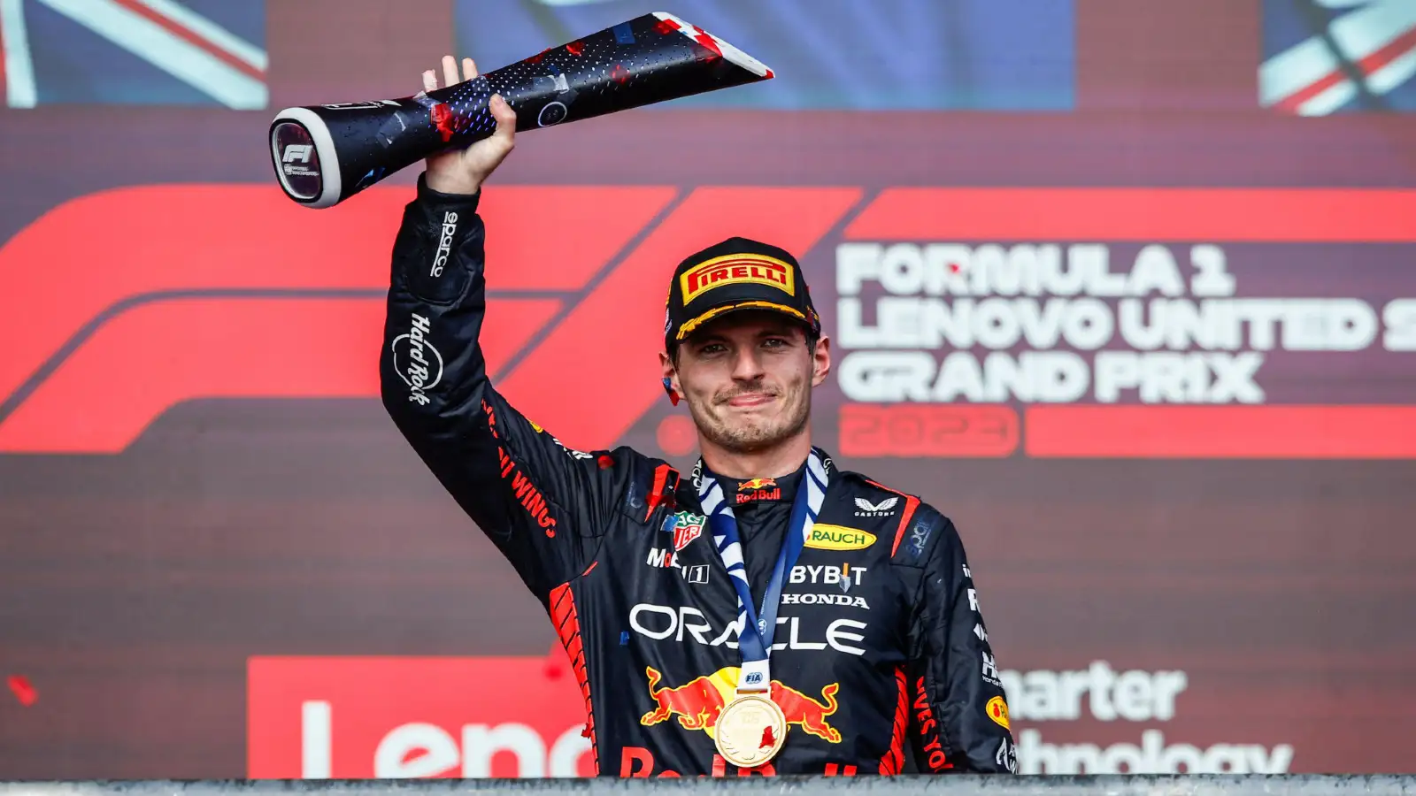 Max Verstappen wins his 50th F1 Grand Prix, celebrating on the podium at the Circuit of the Americas.