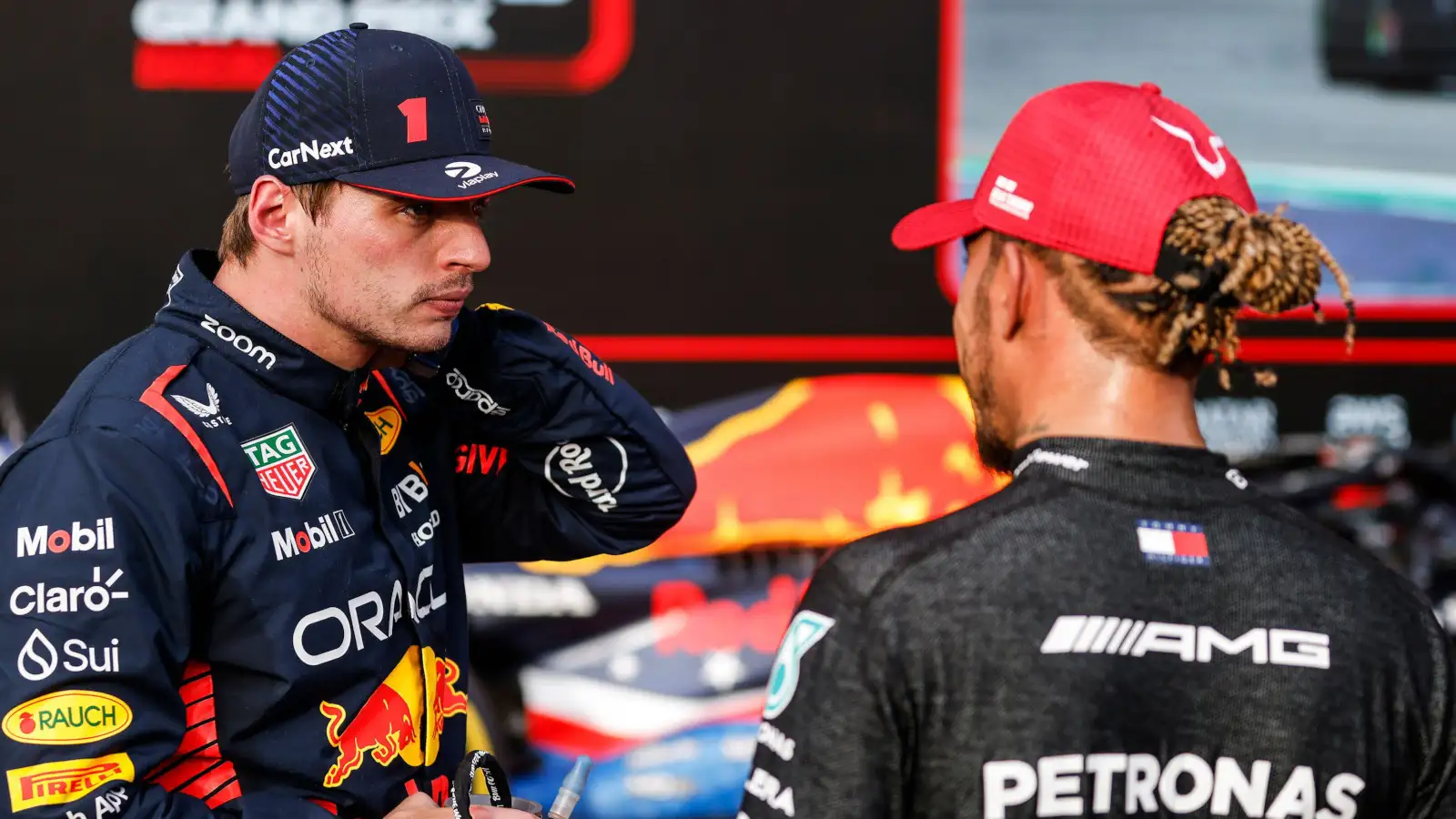 Race winner Max Verstappen speaking with Lewis Hamilton after the race.