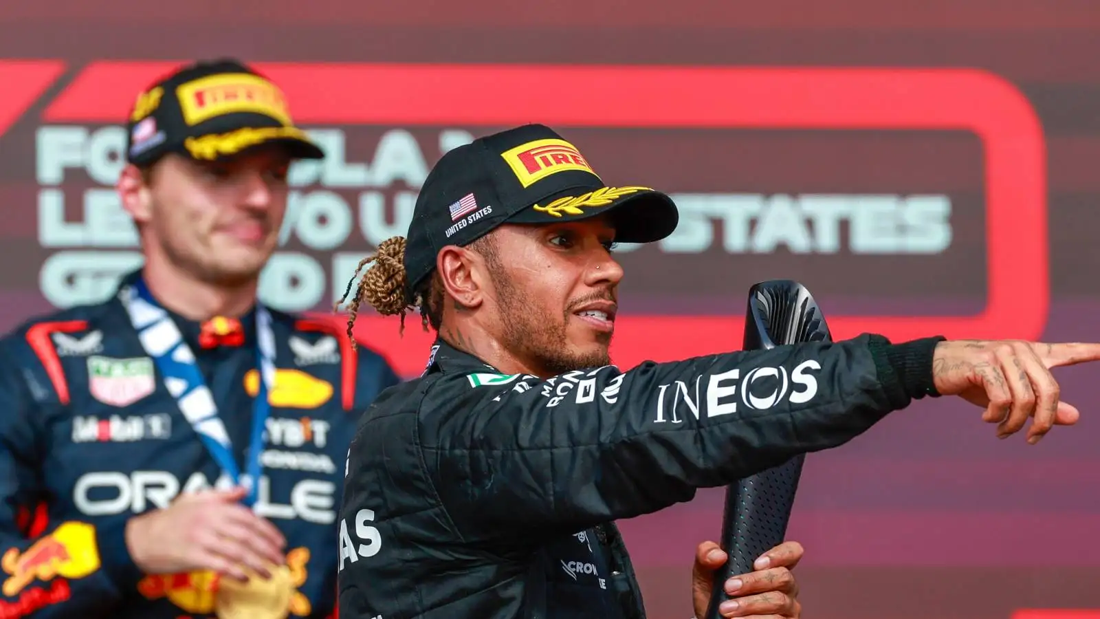 Mercedes driver Lewis Hamilton in front of Red Bull driver Max Verstappen on the podium.