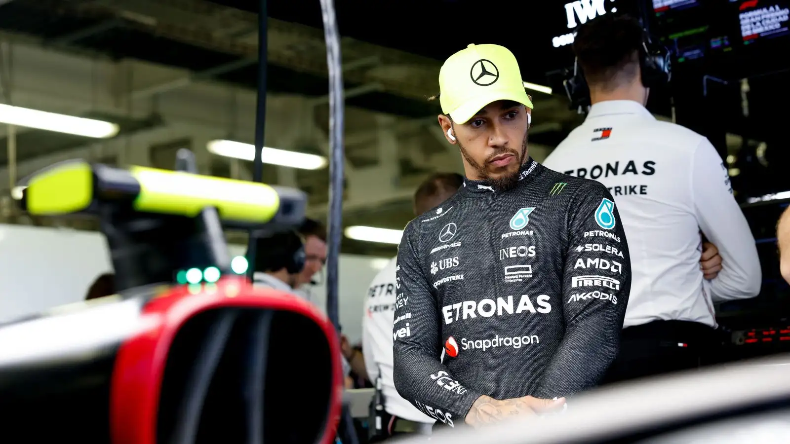 Mercedes driver Lewis Hamilton studies his car in Mexico.