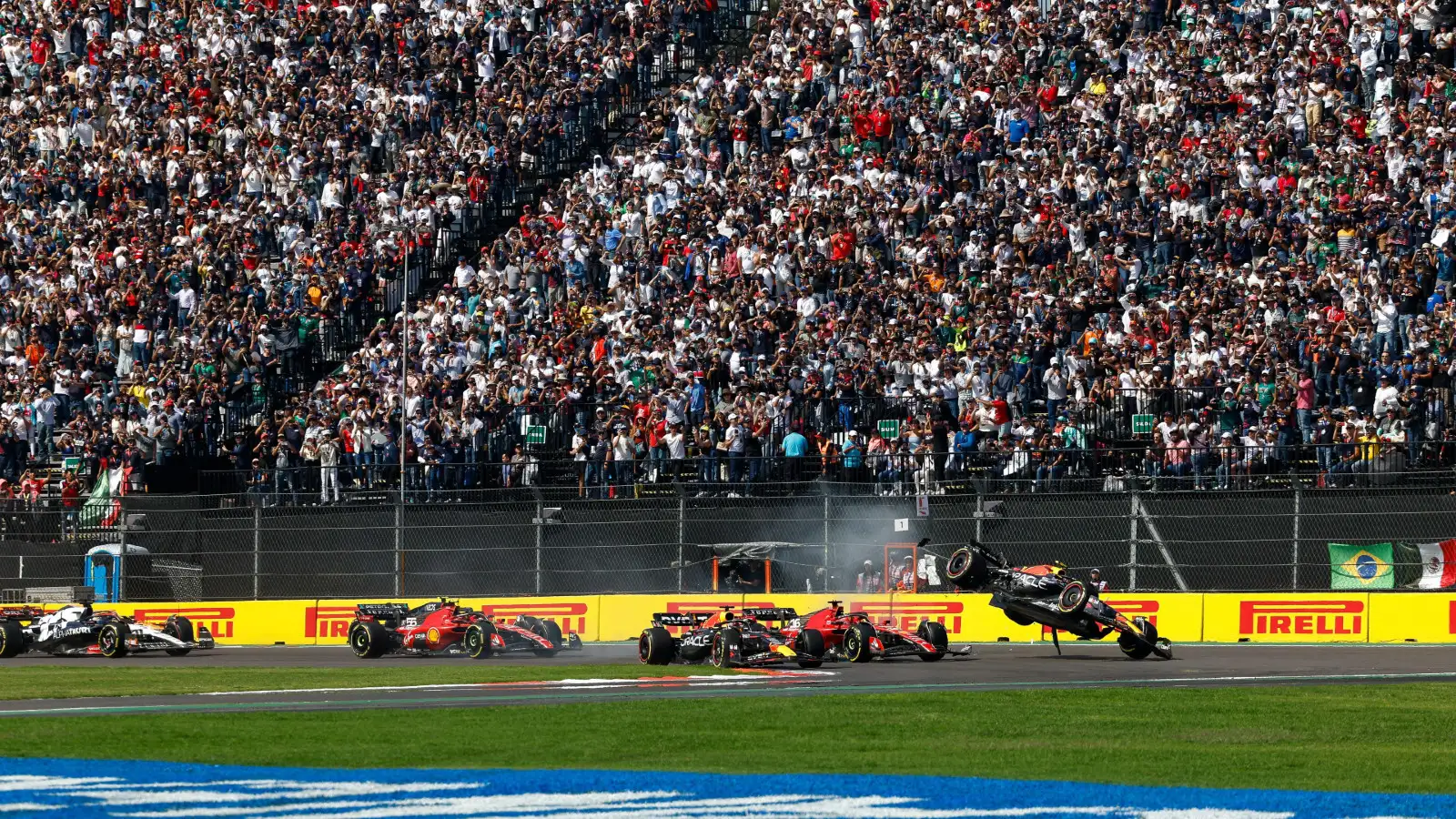 Sergio Perez sails into the air after his Red Bull makes contact with Ferrari's Charles Leclerc in the Mexican Grand Prix.