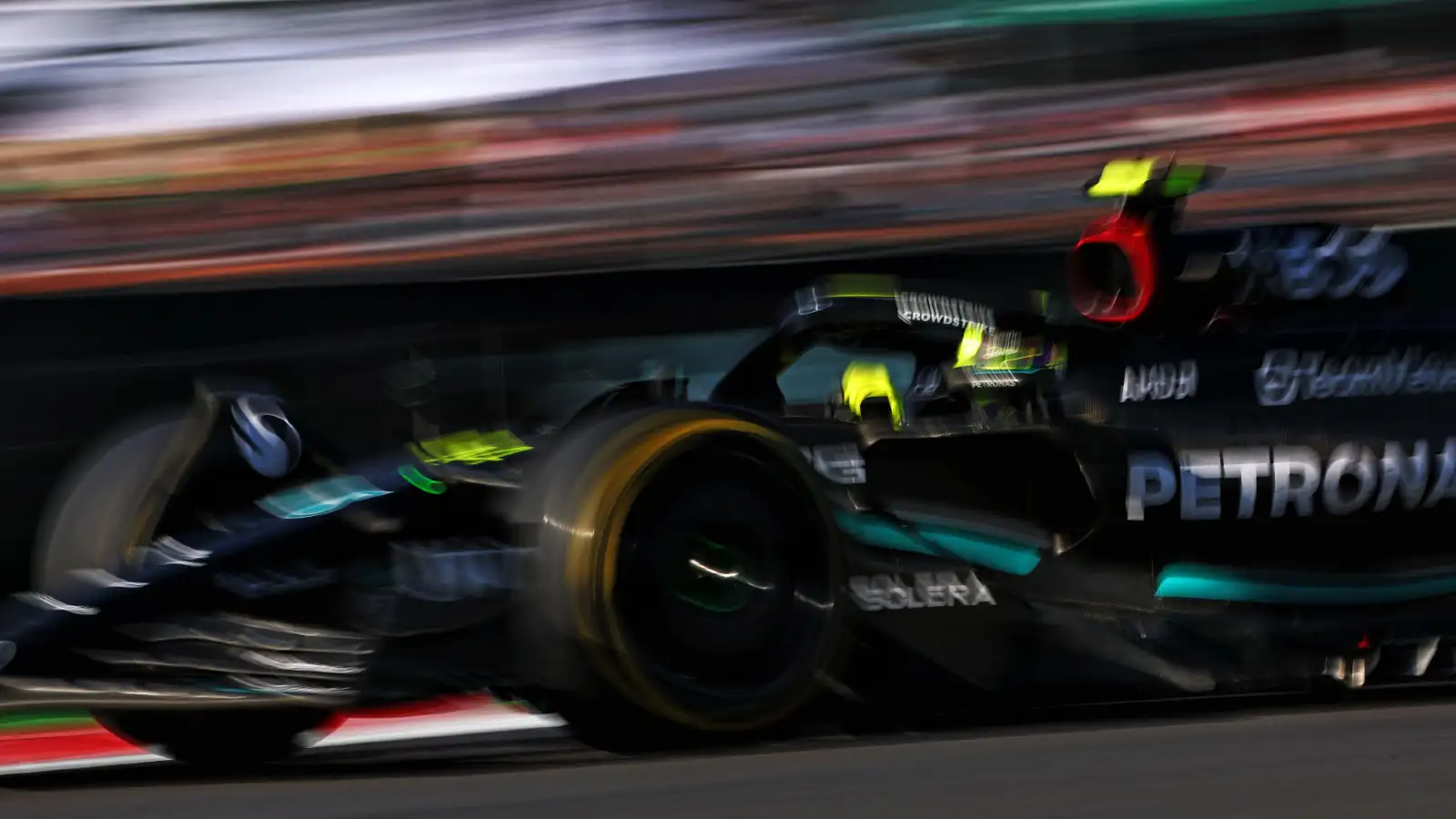 Lewis Hamilton races his Mercedes in a blurry action picture taken during the Mexican Grand Prix.