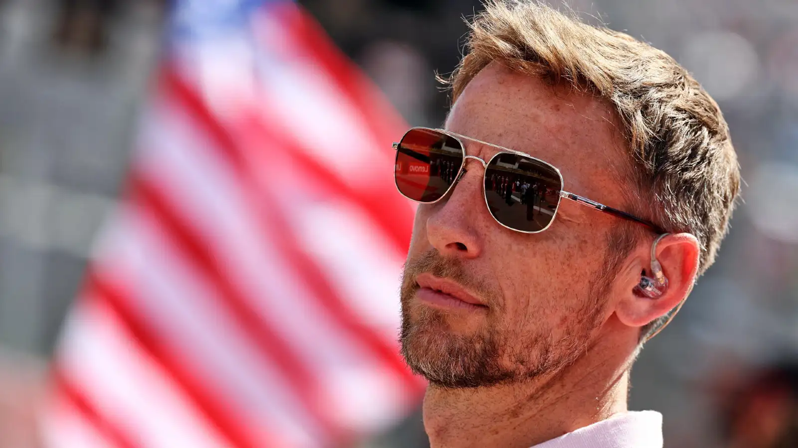 Jenson Button looks on as he works for Sky F1 during the United States Grand Prix.
