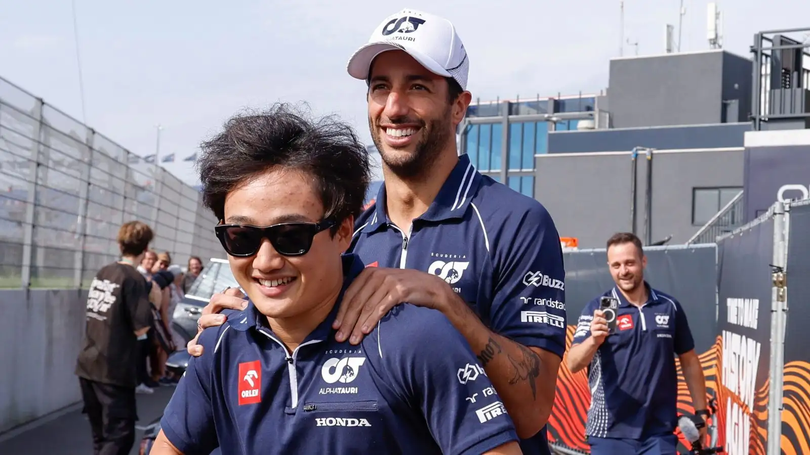Daniel Ricciardo hitches a ride with his AlphaTauri teammate Yuki Tsunoda.
