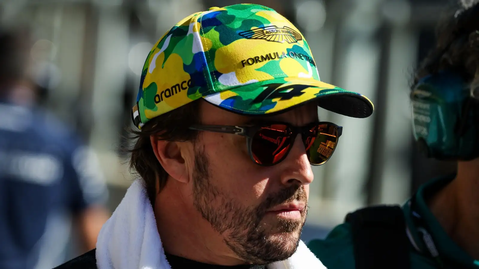 Aston Martin driver Fernando Alonso wearing sunglasses and a cap in Brazil.