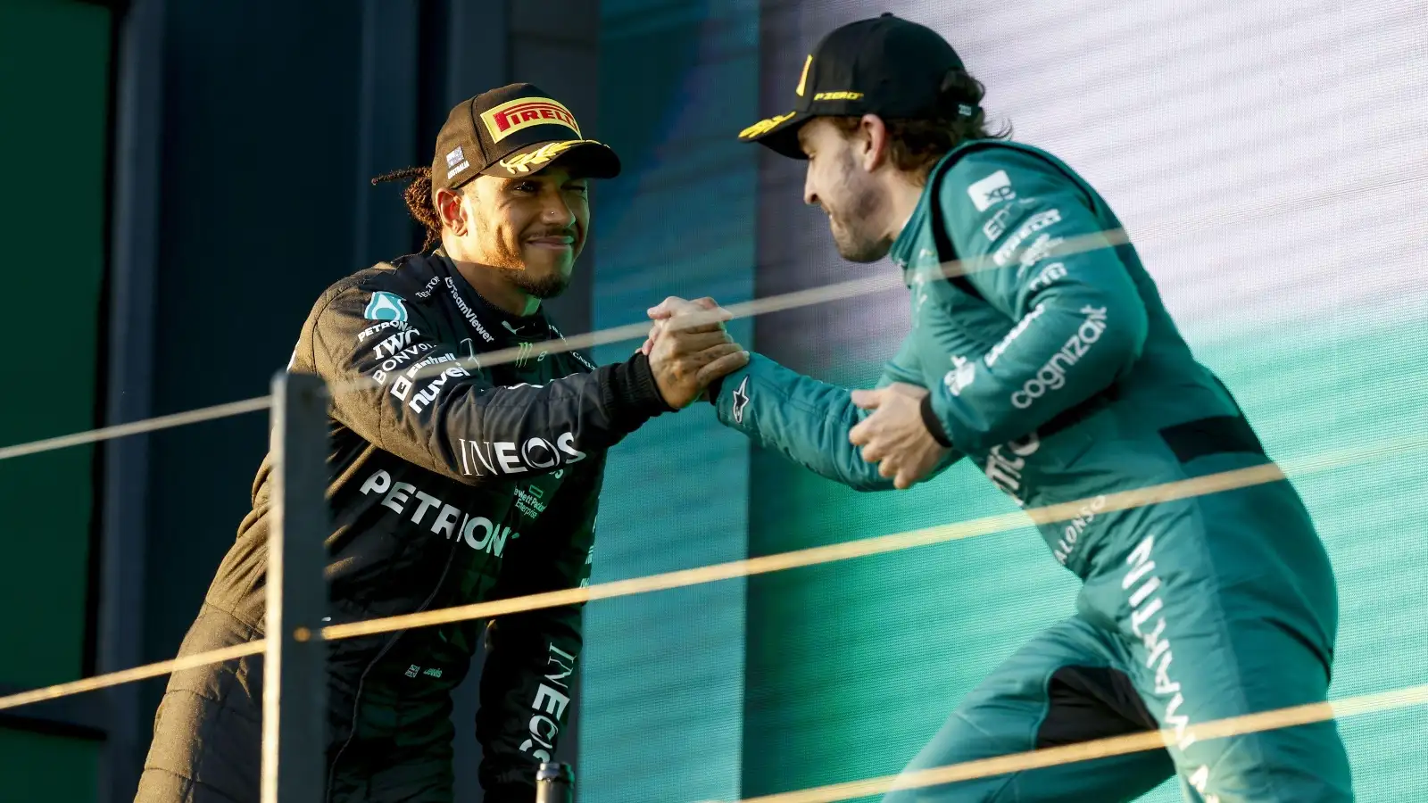 Lewis Hamilton and Fernando Alonso handshake on the podium.