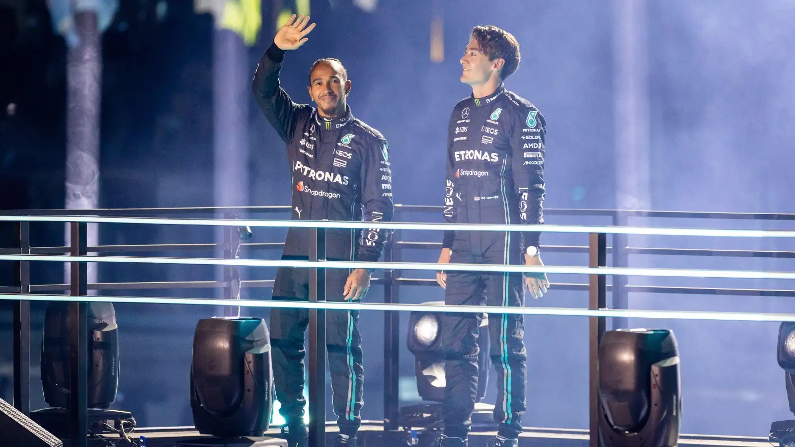 Lewis Hamilton and George Russell wave to the Las Vegas crowd.