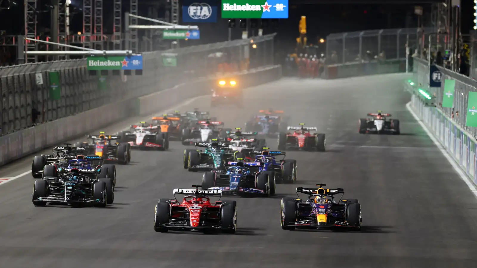 Max Verstappen and Charles Leclerc battle into Turn 1 at the Las Vegas Grand Prix.