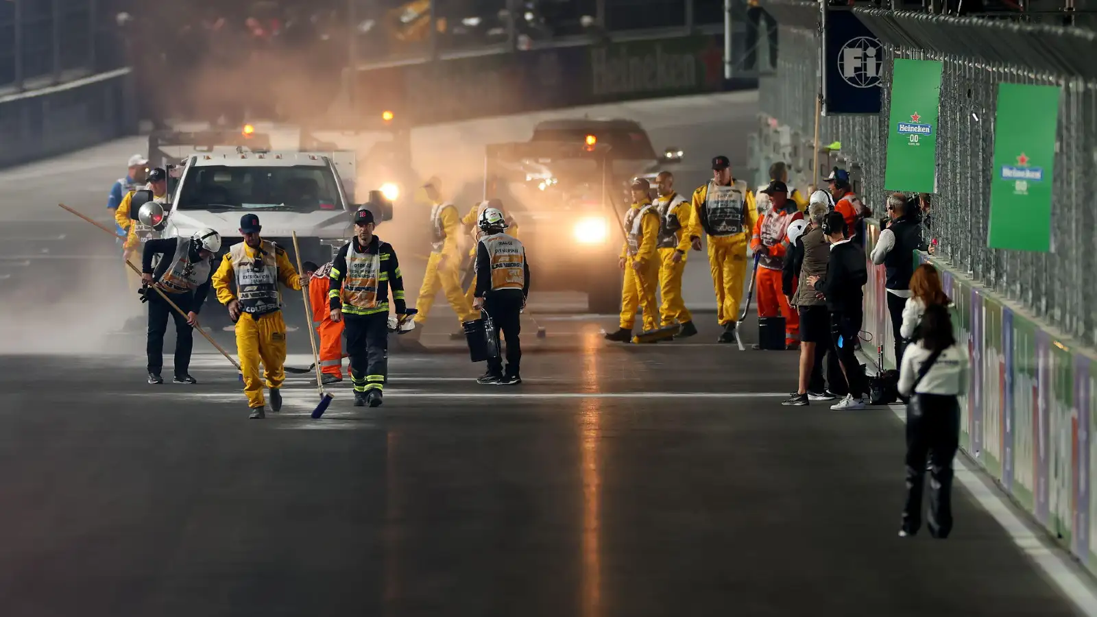 Crews work to clear up an oil spill ahead of the Las Vegas Grand Prix start.