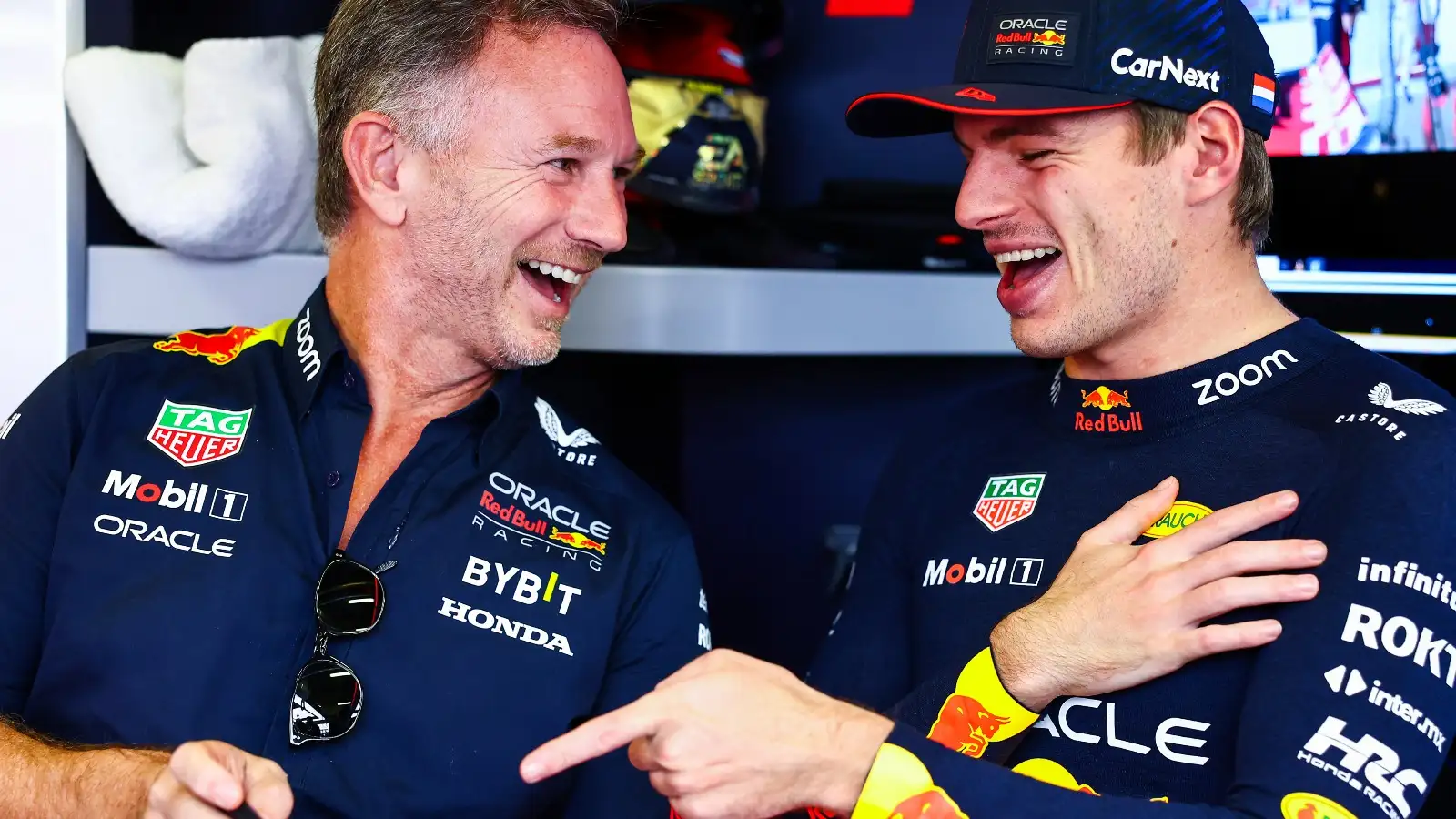 Christian Horner and Max Verstappen laughing.