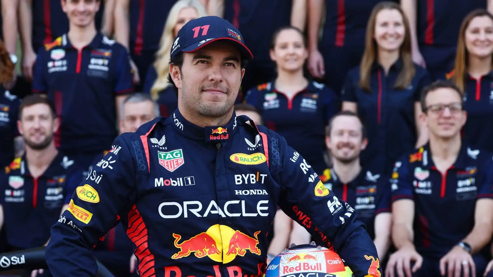Sergio Perez posing for a Red Bull team photo in Abu Dhabi.