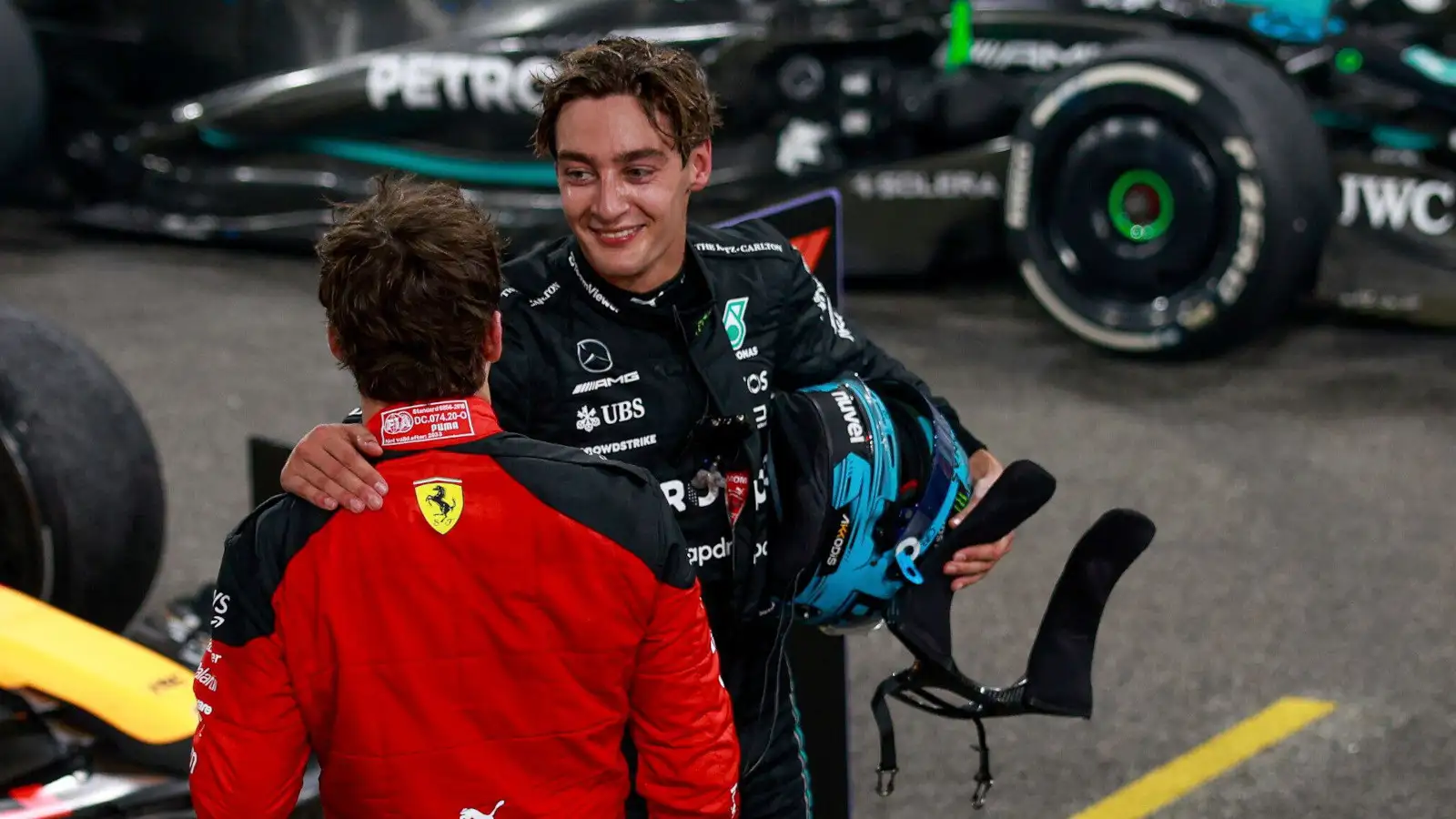 Mercedes driver George Russell and Charles Leclerc speaking after the season finale.