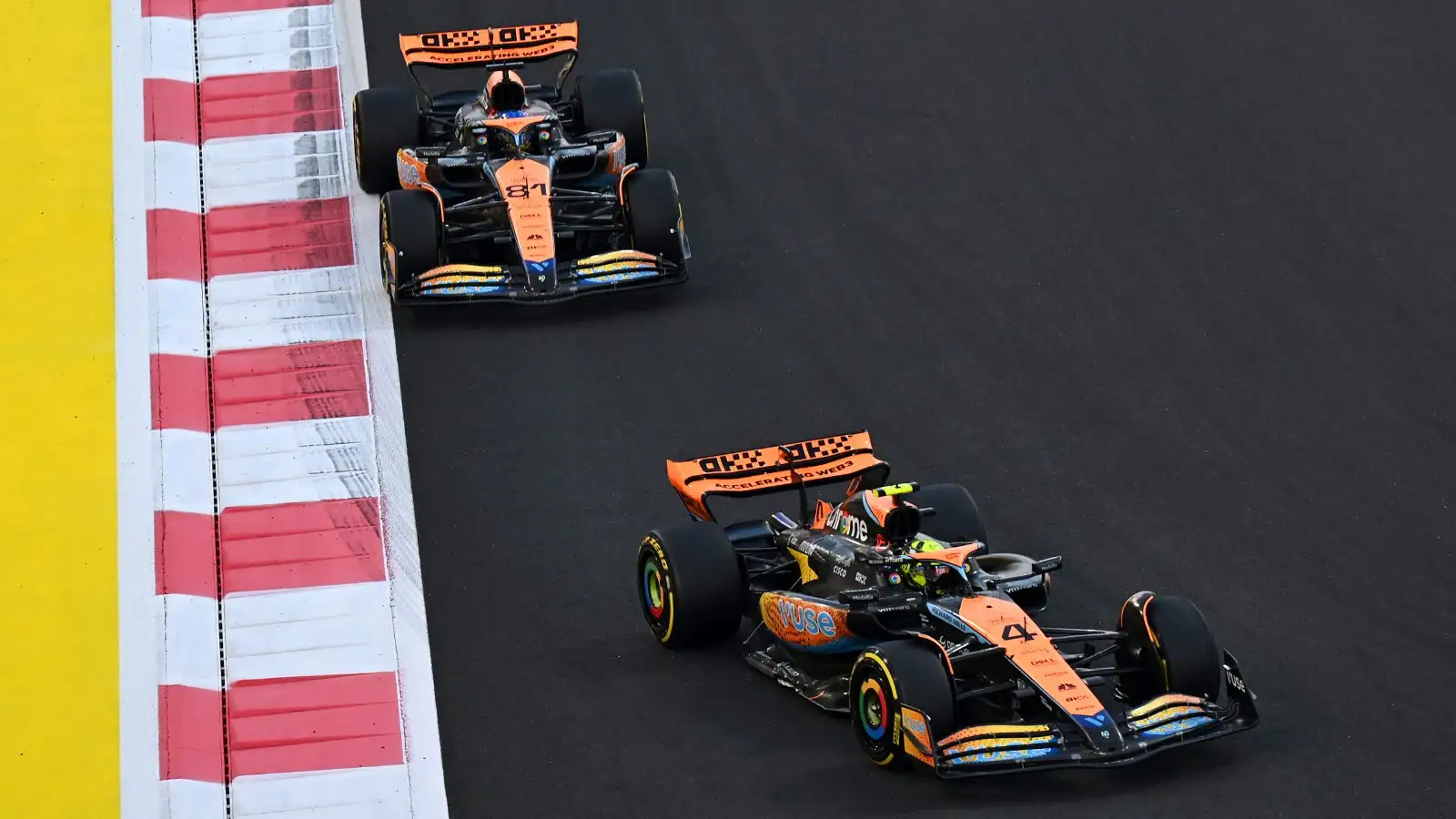 Lando Norris and Oscar Piastri driving the McLarens in Abu Dhabi.