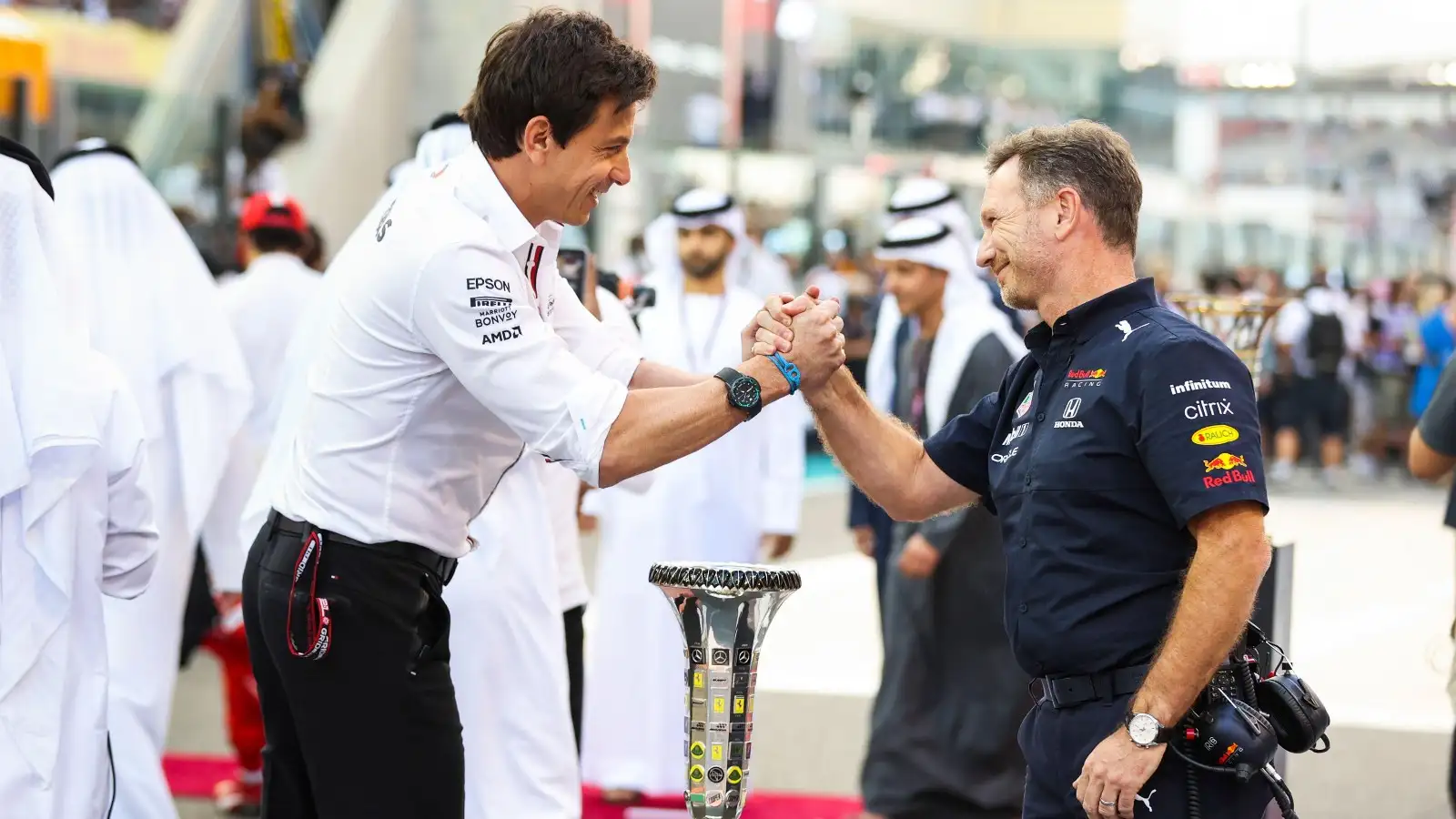 Toto Wolff and Christian Horner shake hands.