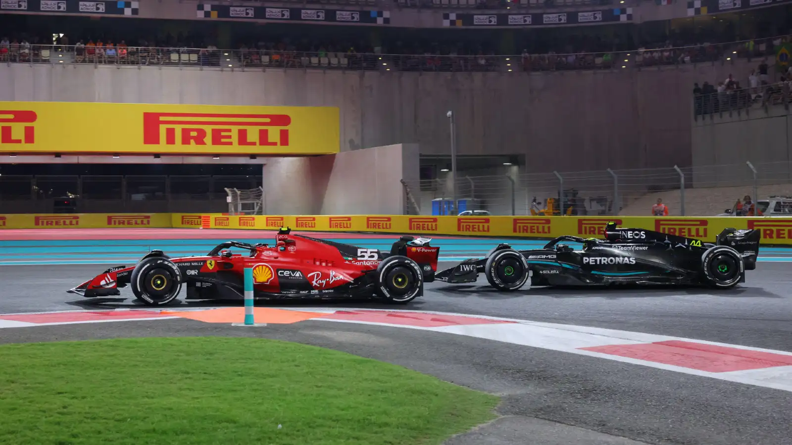 Carlos Sainz holds off Lewis Hamilton at the 2023 Abu Dhabi Grand Prix.